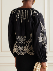 This Kingsley embroidered cotton-poplin blouse by SEA combines delicate craftsmanship with effortless style. Crafted from soft cotton-poplin, it features charming floral and bird embroidery alongside elegant swirling patterns. The loose fit enhances comfort, while scalloped edges and crocheted trims along the notched neckline add a touch of refined detail. Perfect for elevating any outfit with graceful ease.
