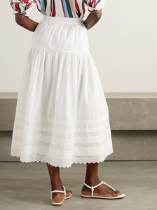Inspired by Edwardian bridal tradition, this Sebastiane skirt combines timeless elegance with modern sustainability. Crafted from organic cotton-poplin, its tiered silhouette features delicate pintucks and elegant broderie anglaise trim, adding a touch of vintage charm to your wardrobe. Perfect for those who appreciate refined detail and eco-conscious fashion.