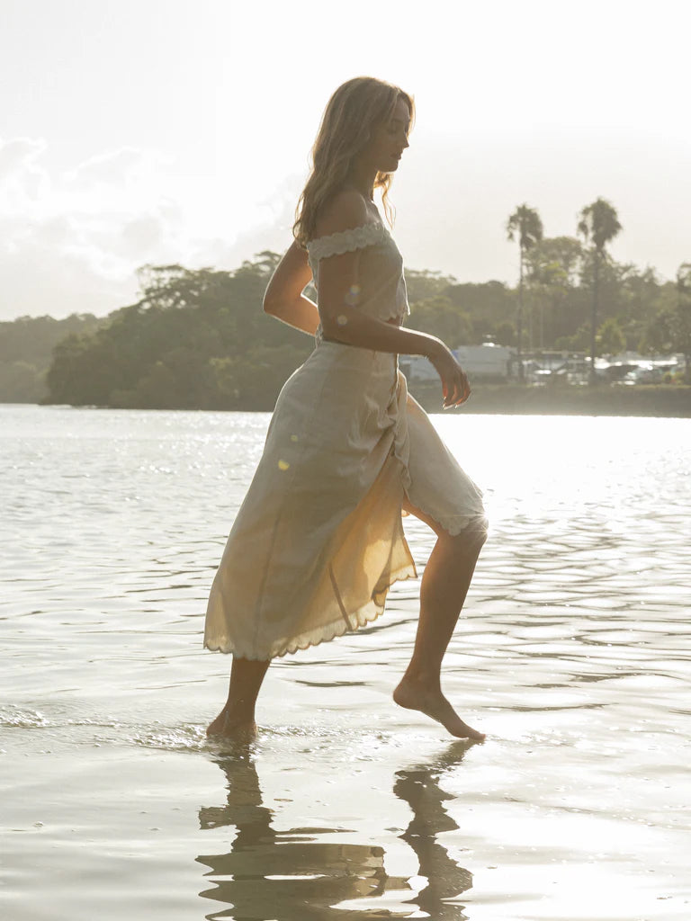 Introducing our Mary Jeane Set - a luxurious and sophisticated ensemble. Hand-cut lace and delicate embroidery on fine linen, with scalloped edging and natural coconut buttons for added elegance. Whether worn at the front or back, this set is a must-have for those who appreciate the finer things.