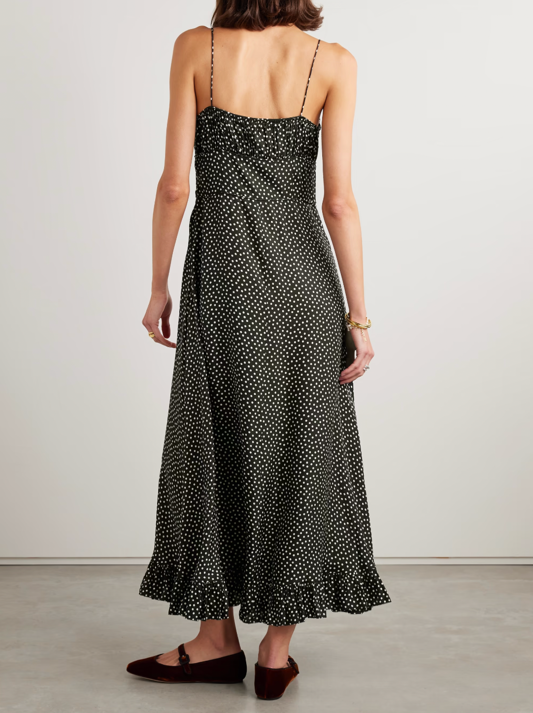 DÔEN's Rosaria midi dress elegantly combines form and detail with its polka-dot silk-blend fabric. Designed with precisely placed panels, it accentuates the silhouette by creating a subtle 'V' shape at the waist, enhancing your natural curves. The gathered bust paired with delicate pin-thin shoulder straps offers refined support while the ruffled hem adds graceful movement, making it a sophisticated choice for any occasion.