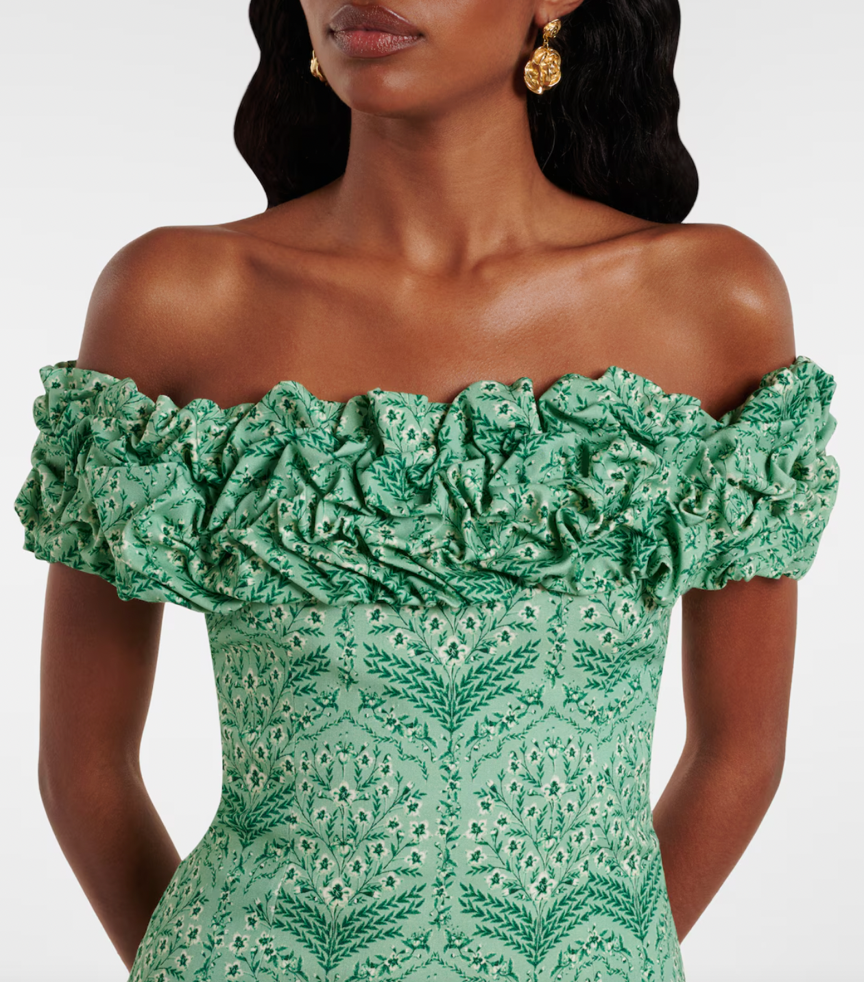 Discover the artistry of Agua by Agua Bendita's Jardín minidress, a stunning piece handcrafted by talented female artisans in Medellín, Colombia. This charming design features a soft cotton-blend poplin fabric with a playful ruffled hem and elegant off-shoulder neckline that flatters every silhouette. Each dress tells a story of skilled craftsmanship and celebrates the vibrant spirit of Colombian artistry. 