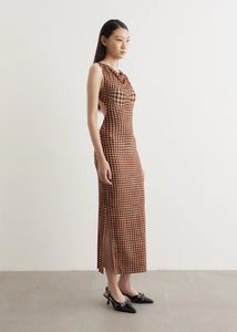 Channel your inner '90s supermodel in the Selena Dress by MIAOU. Made from a soft Tencel blend, this form-fitting maxi dress features a unique plaid pattern for a touch of sophistication. With a round neckline, sleeveless design, and open back, it's the perfect combination of French-girl style and SoCal cool.