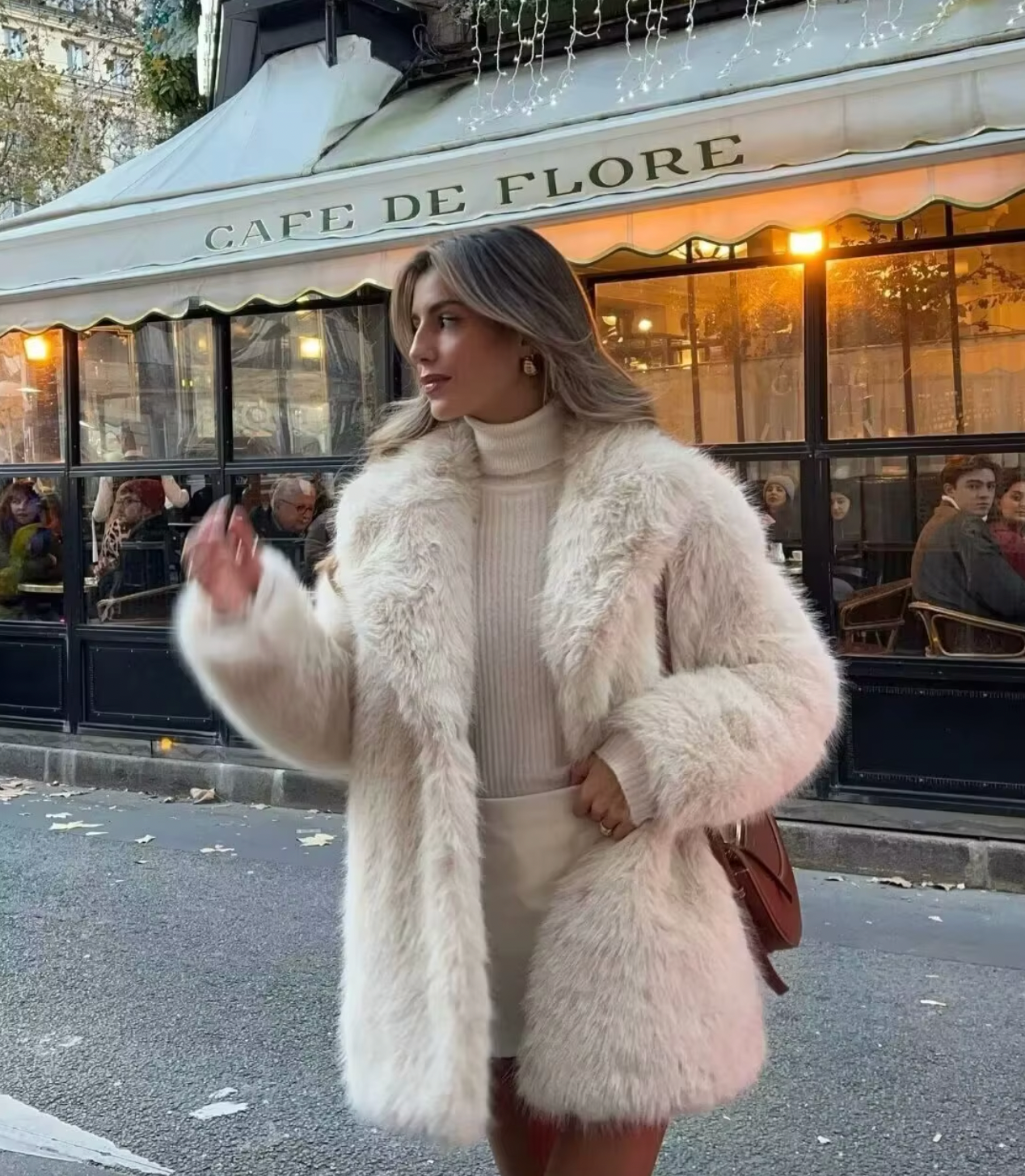 Elevate your winter style with the luxurious Blancha Shearling Coat. This long-sleeved coat features a faux fur lapel, providing both warmth and sophistication. Perfect for the colder seasons, this coat is a must-have for any fashionable woman's wardrobe.