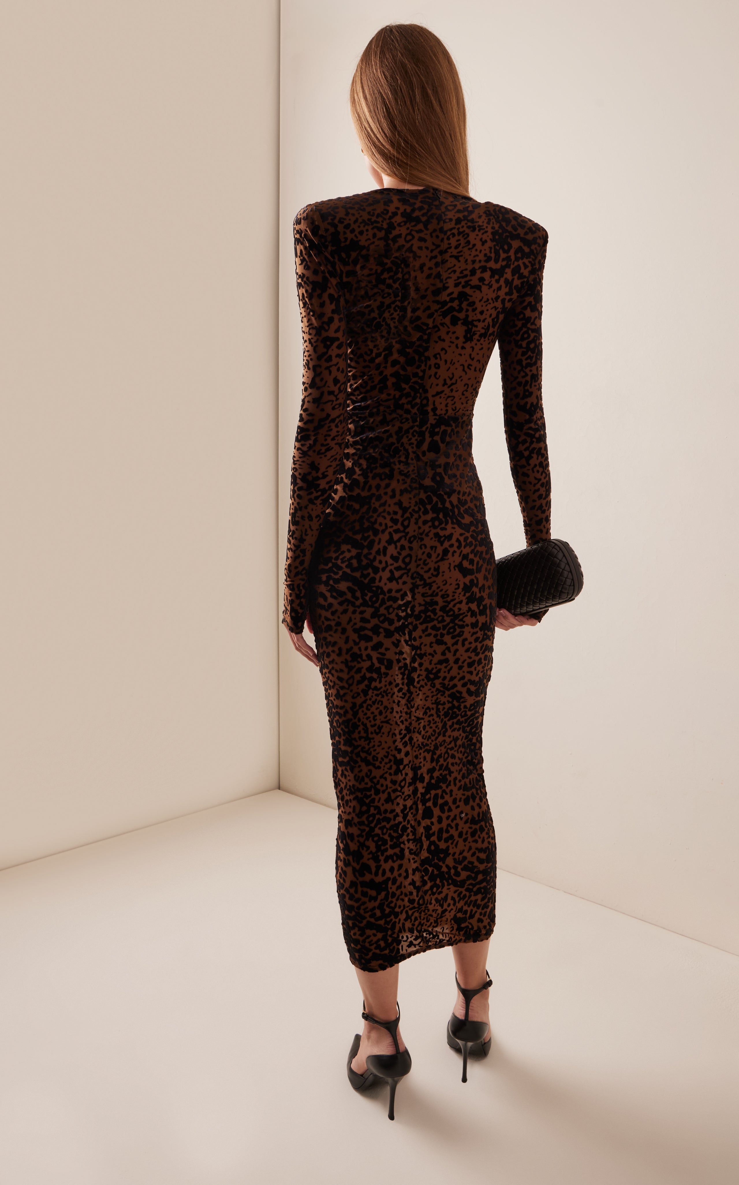 Indulge in the sultry allure of the Plunged Leopard Burnout Mesh Midi Dress by Alex Perry. Crafted from leopard-print burnout mesh, this bodycon silhouette features a deeply plunged neckline that will turn heads. Designed for the Fall/Winter '24 collection, this dress is both sexy and sophisticated. Concealed zip fastening along the back adds a touch of refinement. Made with stretch mesh in a designer color of tobacco, this dress is sure to make a statement at any event.