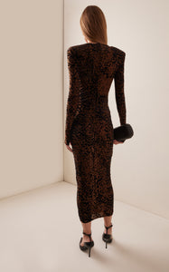 Indulge in the sultry allure of the Plunged Leopard Burnout Mesh Midi Dress by Alex Perry. Crafted from leopard-print burnout mesh, this bodycon silhouette features a deeply plunged neckline that will turn heads. Designed for the Fall/Winter '24 collection, this dress is both sexy and sophisticated. Concealed zip fastening along the back adds a touch of refinement. Made with stretch mesh in a designer color of tobacco, this dress is sure to make a statement at any event.