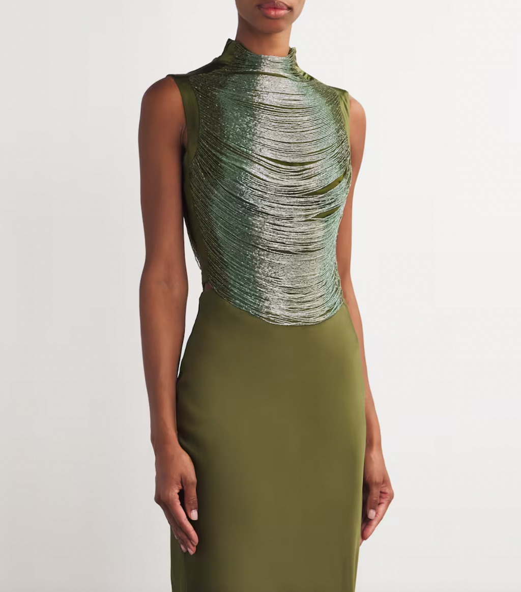 Elevate your wardrobe with the Multi Beaded Taraji Blouse by Cult Gaia, featuring exquisite hand-beaded arcs that highlight Cult Gaia’s commitment to artisanal excellence. The cedar-toned, stretchy side panels ensure a flattering fit while adding subtle contrast. Perfectly paired with the matching Chantel skirt, this blouse transforms any look with its intricate detailing and luxurious craftsmanship.