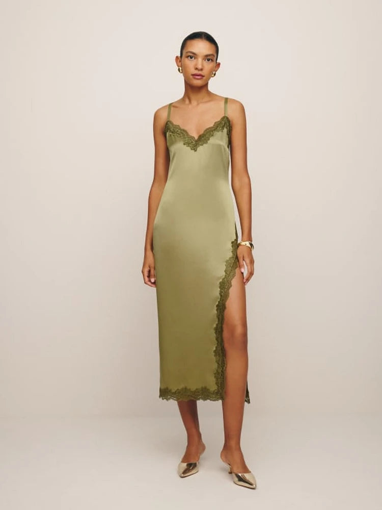 Indulge in pure luxury with the Karissa Silk Dress by Reformation. Crafted from sumptuous silk, this sleeveless midi dress features a flattering V-neckline and delicate lace hem. Perfect for any occasion, it exudes sophistication and elegance. Elevate your wardrobe and make a statement with this must-have piece.