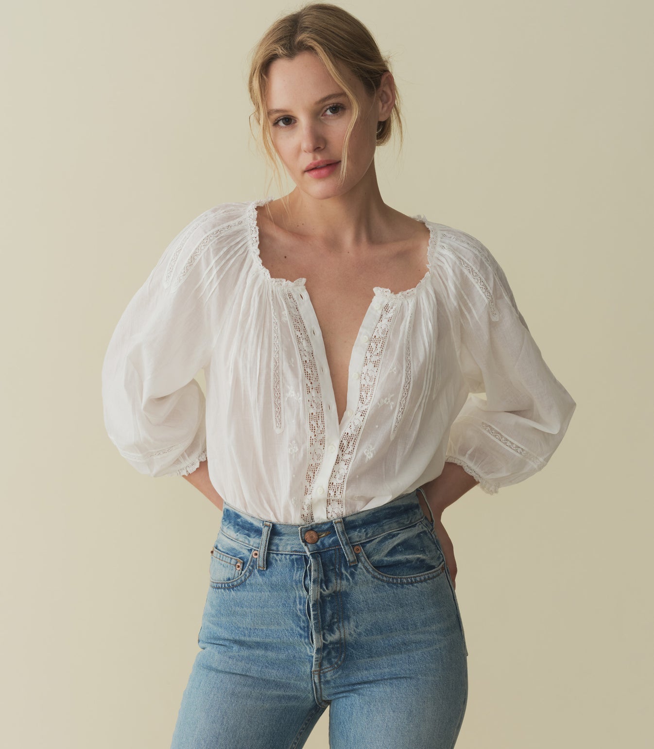 Crafted from a 100% organic cotton voile, the Abigail Top features a breezy silhouette, a round neckline, and buttons running down the center front. Billowy sleeves trimmed with scalloped lace hit just above the wrist, while alternating pintuck clusters, lace, and delicate floral embroidery decorate the front. Leave it loose, or tuck it into your favorite pair of high-waisted jeans.