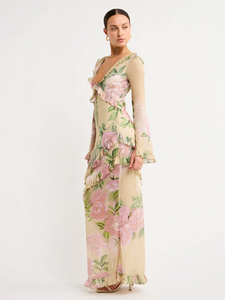 The Isabelle Quinn Louisa Dress in Romantic Floral is an elegant evening piece for special occasions.  Carefully crafted from a lightweight fabrication, this luxurious, full-length maxi dress features a ruffle neckline and a keyhole tie detailing,  Falling to skirt with femenine asymmetrical frill detailing, this unique silhouette is perfect for a birthday celebration, cocktail hour, or date night. 
