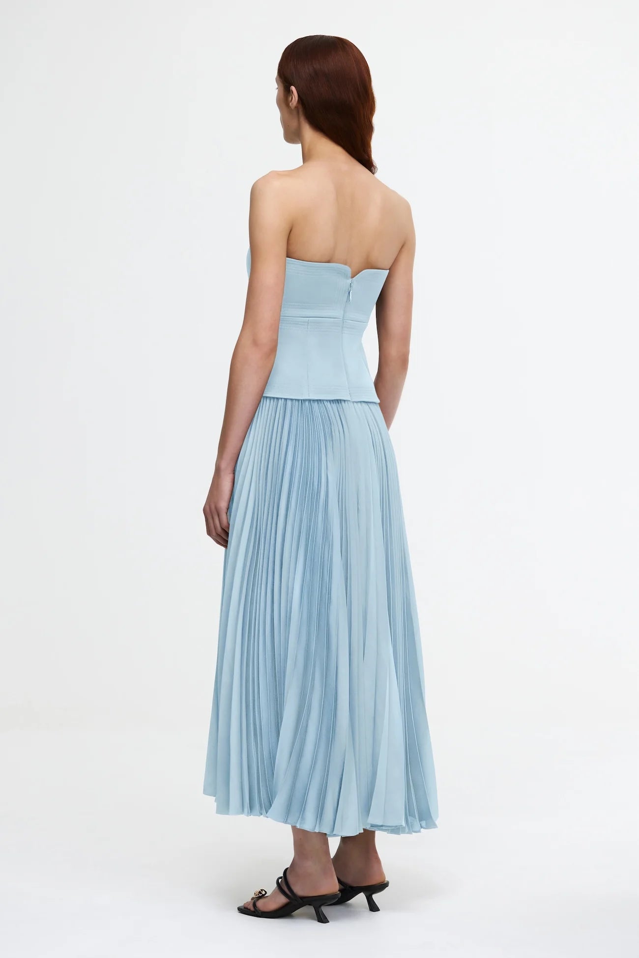 Introducing the Avonlea Dress by ACLER - a modern interpretation of the timeless Acler silhouette. Crafted in Celeste Blue, this midi dress boasts a structured bodice and square neckline, perfectly complementing the signature pleated fabric for a feminine, flowing look. Elevate your style with this exclusive piece.