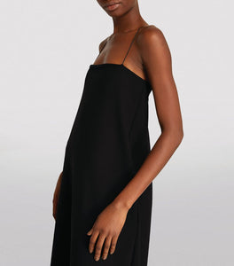 Effortlessly elegant, the Cenoa Maxi Dress from THE ROW is the perfect spring/summer staple. Designed with thin shoulder straps and a tall, floor length silhouette, this dress exudes an old money style that is both timeless and chic. A must-have for any wardrobe, the Cenoa Slip Dress offers versatile fashion for any occasion.