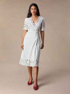 Transform your wardrobe with our Sara Midi Dress! This stunning white embroidered wrap dress exudes elegance and charm. Perfect for any occasion, its mid-length style offers a timeless silhouette that will flatter any body type. Make a statement with this must-have dress that will leave you feeling confident and beautiful.