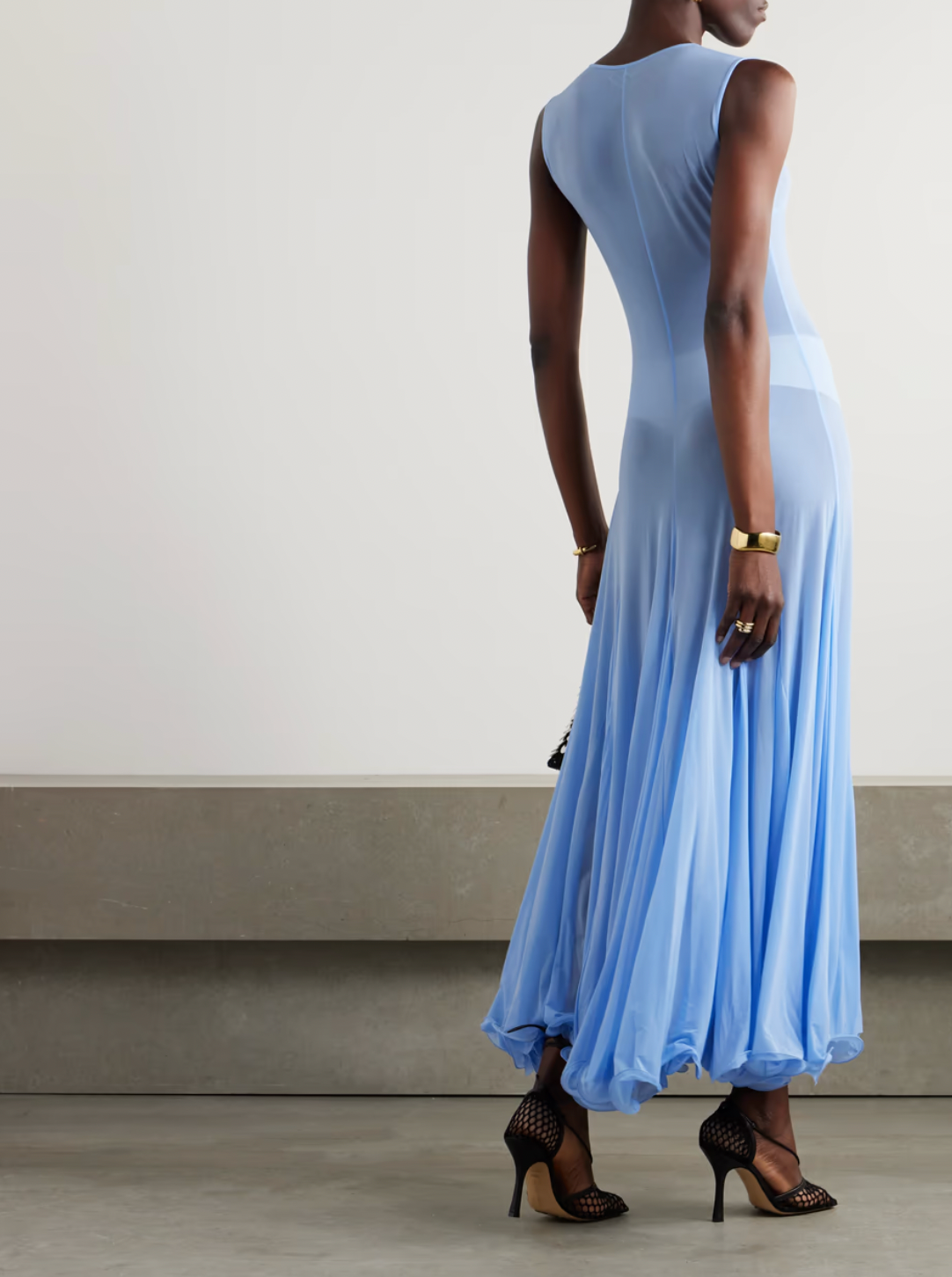 This Pleated Jersey Maxi Dress embodies Magda Butrym's signature style, with unexpected fabrics and unconventional details. The lightweight jersey fabric gracefully drapes over your body, while the artful pleating on the skirt adds a touch of elegance. Keep the sheer finish in mind when selecting your undergarments. Elevate your wardrobe with this luxury piece.