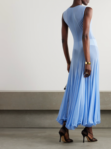 This Pleated Jersey Maxi Dress embodies Magda Butrym's signature style, with unexpected fabrics and unconventional details. The lightweight jersey fabric gracefully drapes over your body, while the artful pleating on the skirt adds a touch of elegance. Keep the sheer finish in mind when selecting your undergarments. Elevate your wardrobe with this luxury piece.