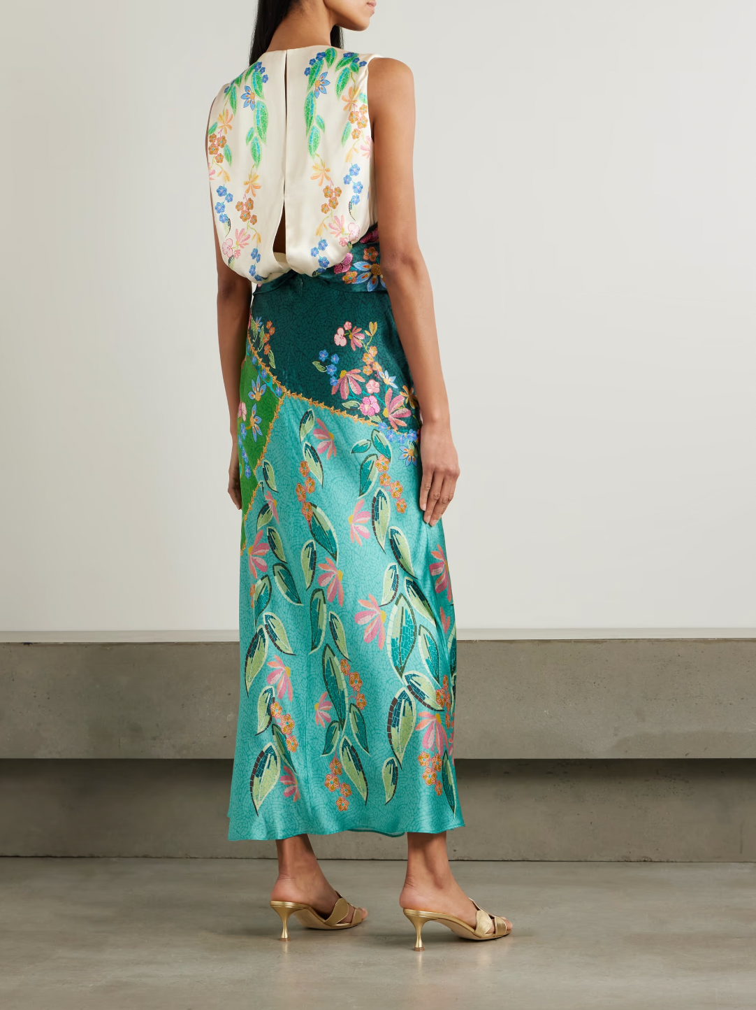 Elevate your wardrobe with the Gwen Twisted Draped Floral-print Silk Maxi Dress in Terrazzo by Saloni. Crafted from luxurious silk, it offers a flattering crew neckline and a uniquely twisted waist that enhances your silhouette. The straight skirt adds elegant movement, making it perfect for both daytime events and evening occasions. Experience comfort and style in one stunning dress designed to turn heads effortlessly.