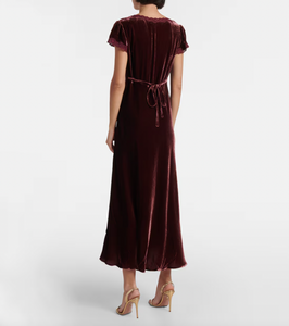 Indulge in luxury with the Clarice Dress, a perfect party-ready midi dress. Crafted from smooth velvet and delicate silk, this dress exudes elegance and softness. With its sophisticated design, you'll be the center of attention at any event.