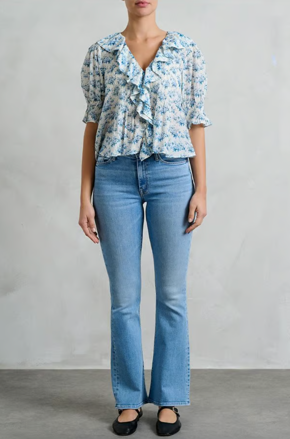 The Henri Top is a stunning blend of romantic Victorian aesthetics and modern sophistication. Made from soft, lightweight organic cotton voile, it features a plunging V-neckline adorned with cascading lace-trimmed ruffles. Delicate clustered pintucks accent the yoke and puffed sleeves, while hidden starburst buttons add a unique touch. Perfect for both casual outings and special occasions, this blouse effortlessly elevates any outfit with its vintage charm and playful elegance.