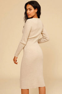 Experience effortless chic this autumn and winter with our Ines Midi Dress. Made from high-quality rib knit fabric, this vintage cutout dress features a figure-hugging silhouette, cascading cut-outs with bows, and a crew neckline. Perfect for work from home or dressing up on off-duty days. Complete the look with mid-calf heeled boots and a snakeskin baguette bag.