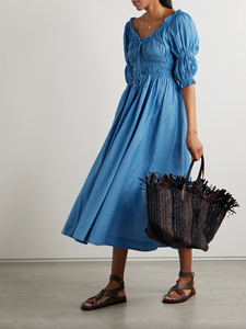 Indulge in the romantic and breezy style of the Ischia Dress. Made from a soft and lightweight cotton-blend voile, it features elegant puffed sleeves and flattering shirred panels that cinch in at the waist. Perfect for any occasion, pair with slides or mules for an effortless and chic look.