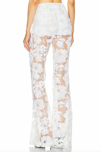 Add a touch of sparkle to your wardrobe with these Lennon embroidered trousers by AKNVAS. Featuring mesh fabric with delicate sequin embellishments, these trousers will elevate any outfit and make you stand out. Dress them up or down for versatile and eye-catching style.