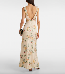 Indulge in luxurious elegance with our Floral Draped Maxi Dress by Toteme. The intricate floral print and draped design effortlessly elevate your style, while allowing for comfortable movement. Perfect for any occasion, this dress exudes sophistication and exclusivity. Experience the beauty of art and fashion with every wearing.