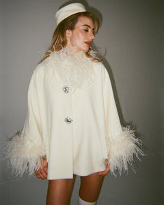 Experience unparalleled elegance and warmth with the Angelica Coat. Made from sumptuous ostrich wool, its flattering A-line shape ensures comfort and style during colder days. Eye-catching fur details on the sleeves and neckline add a luxurious edge, while custom silver buckles offer a refined, exclusive touch. This coat is the perfect choice for those who want to stay chic and cozy all winter long.