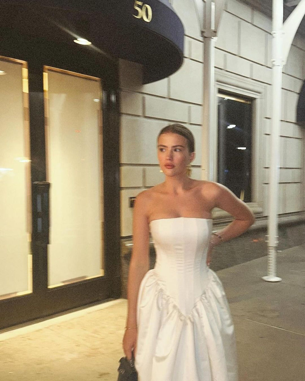 Elevate your look with the Arielle Dress. This strapless design exudes femininity and versatility. From the ceremony to the after-party, this dress effortlessly adapts to your desired style. With the Arielle, you'll have the perfect cocktail outfit for any occasion.