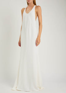Experience modern sophistication with the Marcel crepe maxi dress by Jacquemus. Its sleek racerback silhouette and expertly crafted panels gently contour your figure, while the smooth crepe fabric flows gracefully to the floor. Perfect for minimalist sandals and delicate jewelry, this dress combines sporty elegance with subtle glamour, making it an effortless choice for refined, polished looks.