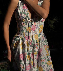 The 'Emelina' dress exudes effortless elegance with its blend of cotton-rich fabric and stretch, perfect for any occasion. The gathered bust and corseted waist create a flattering silhouette, while the midi skirt adds a feminine touch. The versatile white vintage rose print and convenient back zipper make it a go-to choice for any season.