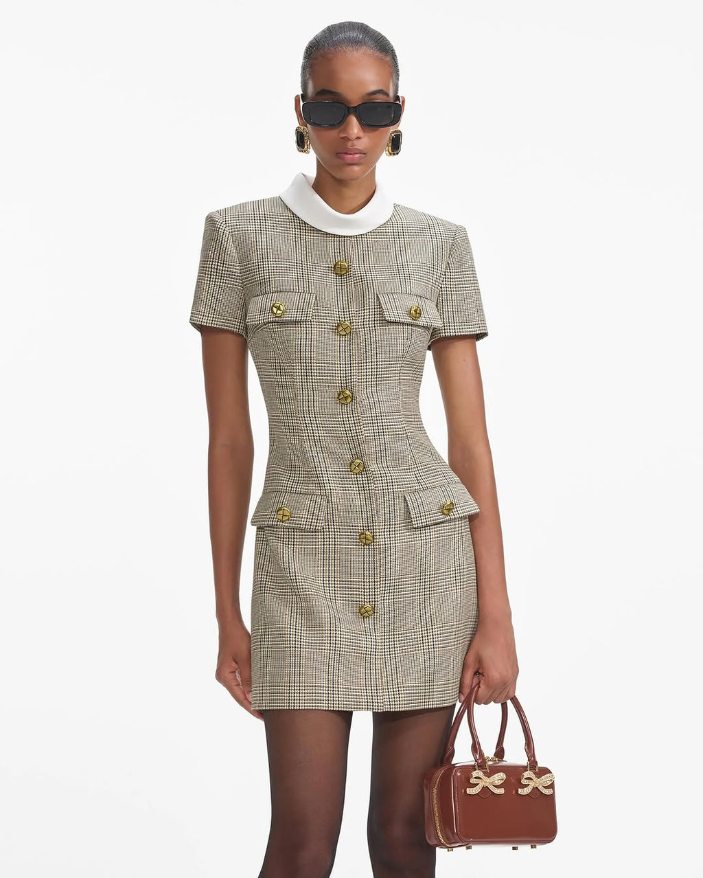 Experience the ultimate in luxury with the Check Wool Mini Dress by Self-Portrait. Fully lined and featuring a faux front button closure, this dress offers both convenience and sophistication. The midweight twill fabric is complemented by padded shoulders, creating a chic and bold silhouette. Plus, the 4-pocket design adds functionality to this stylish piece.