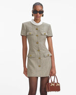 Load image into Gallery viewer, Experience the ultimate in luxury with the Check Wool Mini Dress by Self-Portrait. Fully lined and featuring a faux front button closure, this dress offers both convenience and sophistication. The midweight twill fabric is complemented by padded shoulders, creating a chic and bold silhouette. Plus, the 4-pocket design adds functionality to this stylish piece.
