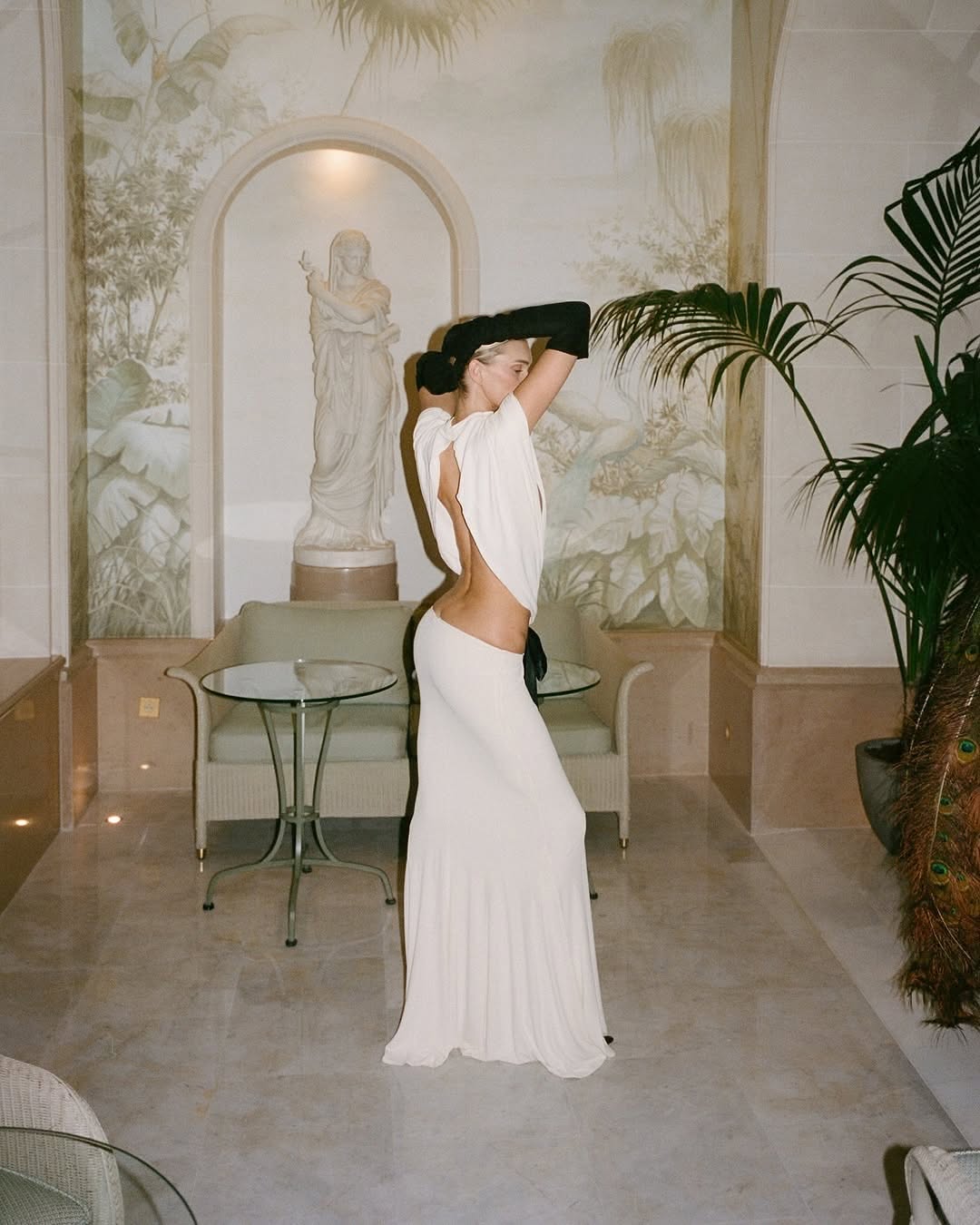 The Constantina Jersey Dress With Bow blends sophisticated design with comfort. Crafted from soft jersey fabric, it offers a flattering pull-on fit highlighted by distinctive cut-outs at the back and waist, creating a contemporary silhouette. Its partial lining ensures ease of wear, while the delicate satin bow adds an elegant finishing touch. Perfect for special occasions, this dress is a refined choice that seamlessly marries style and comfort.