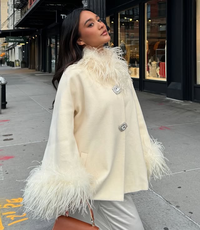 Experience unparalleled elegance and warmth with the Angelica Coat. Made from sumptuous ostrich wool, its flattering A-line shape ensures comfort and style during colder days. Eye-catching fur details on the sleeves and neckline add a luxurious edge, while custom silver buckles offer a refined, exclusive touch. This coat is the perfect choice for those who want to stay chic and cozy all winter long.
