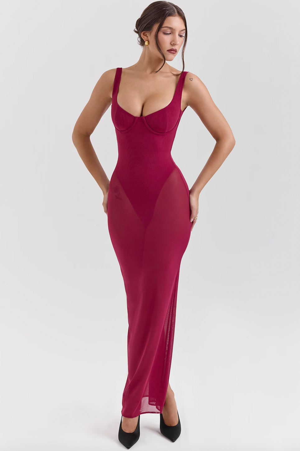 Indulge in luxury with the Robina Maxi Dress. This enchanting dress exudes elegance and allure in a rich Wine hue. The mesh design hugs your body, making every entrance unforgettable. Elevate your style and captivate all with this show-stopping piece.