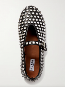 Transform any outfit into a showstopper with ALAÏA's crystal-embellished leather ballet flats. These luxurious and elegant flats add a touch of glamour to any occasion. Comfortable yet stylish, these flats are perfect for any fashion-forward individual. Elevate your wardrobe with these stunning ballet flats!