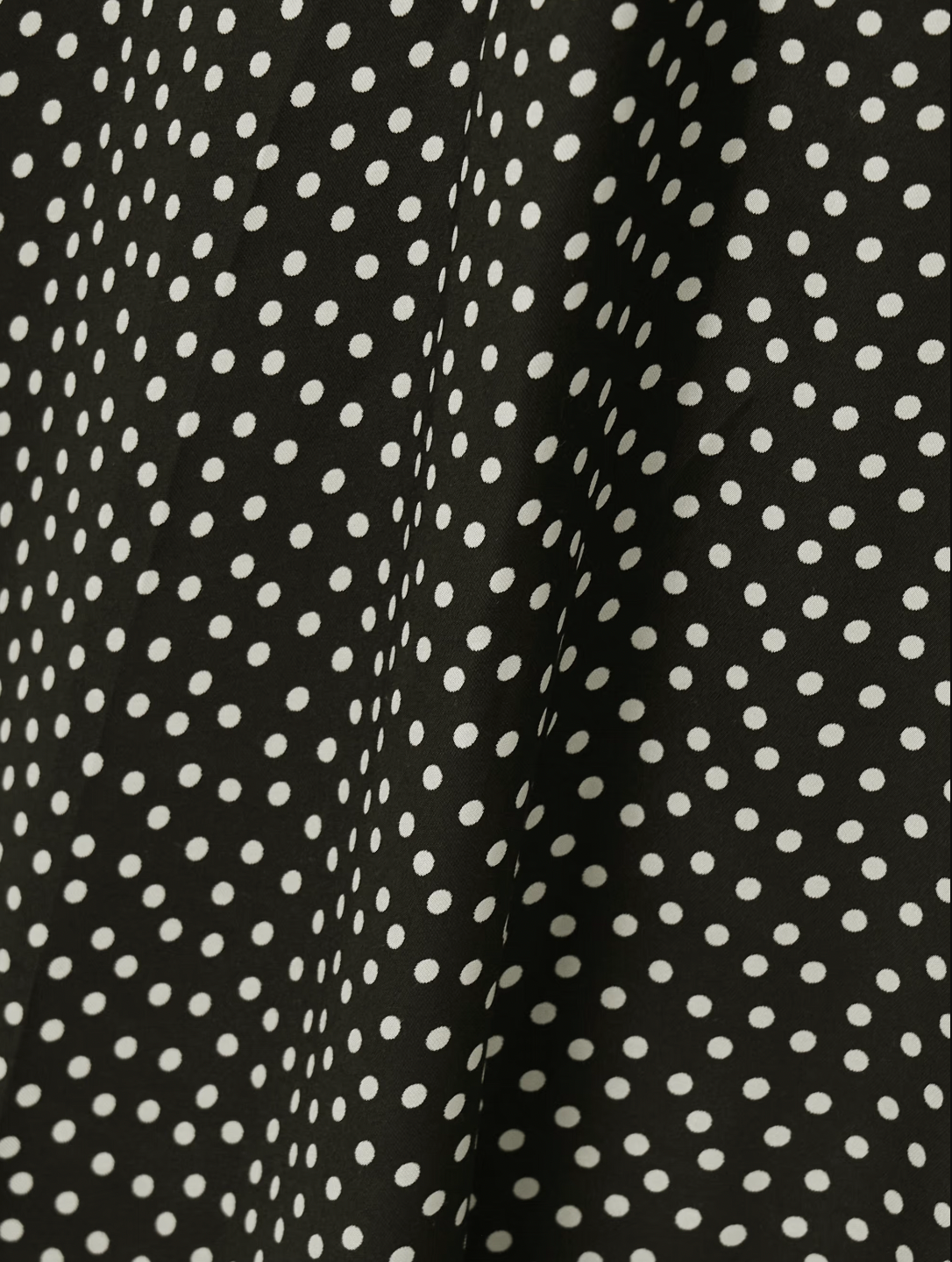 DÔEN's Rosaria midi dress elegantly combines form and detail with its polka-dot silk-blend fabric. Designed with precisely placed panels, it accentuates the silhouette by creating a subtle 'V' shape at the waist, enhancing your natural curves. The gathered bust paired with delicate pin-thin shoulder straps offers refined support while the ruffled hem adds graceful movement, making it a sophisticated choice for any occasion.