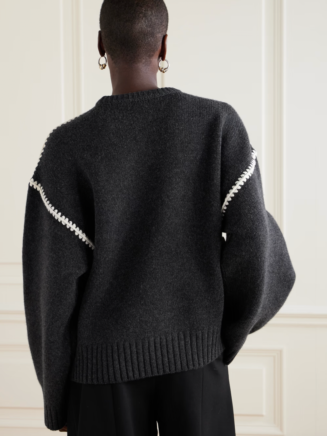 Elevate your wardrobe with this oversized sweater by Toteme crafted from a sumptuous wool and cashmere blend. Its relaxed fit with dropped shoulders offers effortless comfort, while the contrasting cream embroidery adds a refined, distinctive touch. Designed as a timeless staple, it seamlessly enriches your collection, providing both warmth and style for any occasion.