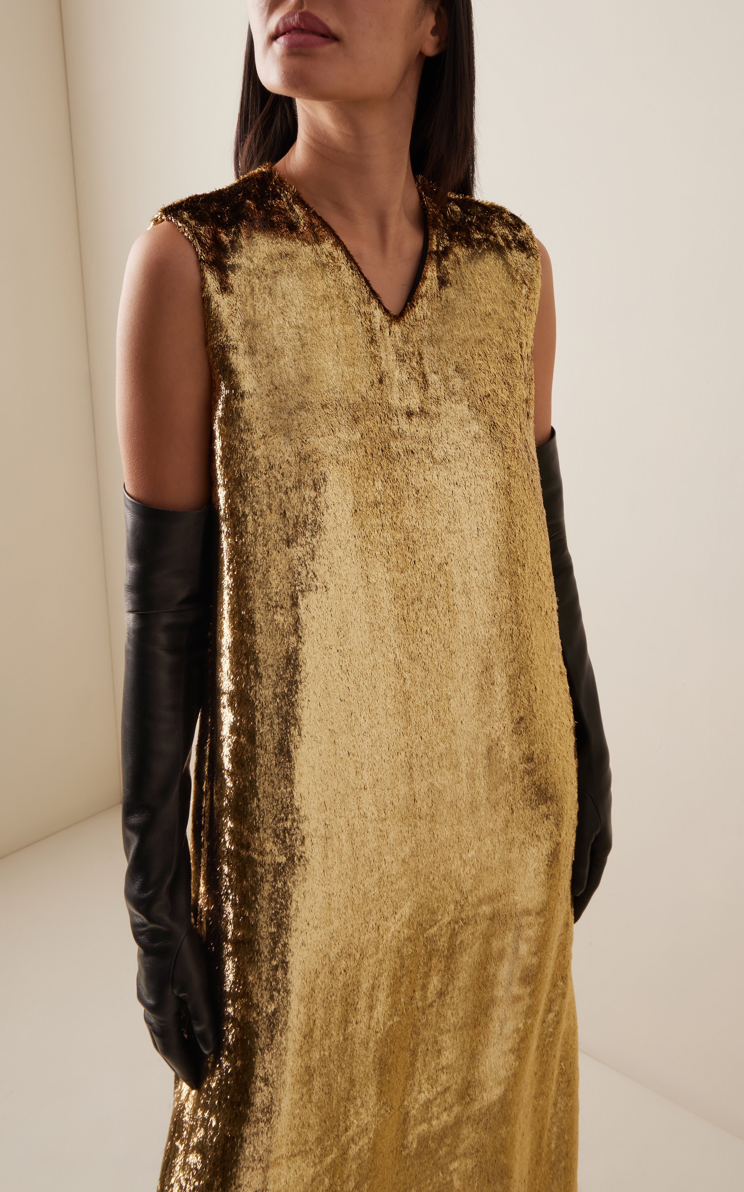 Discover the luxurious simplicity of the Louane Metallic Silk Dress from The Row. Impeccable details and exceptional fabrics combine to create a timeless staple with a touch of irreverence. Elevate your wardrobe with this effortless and high-quality piece.