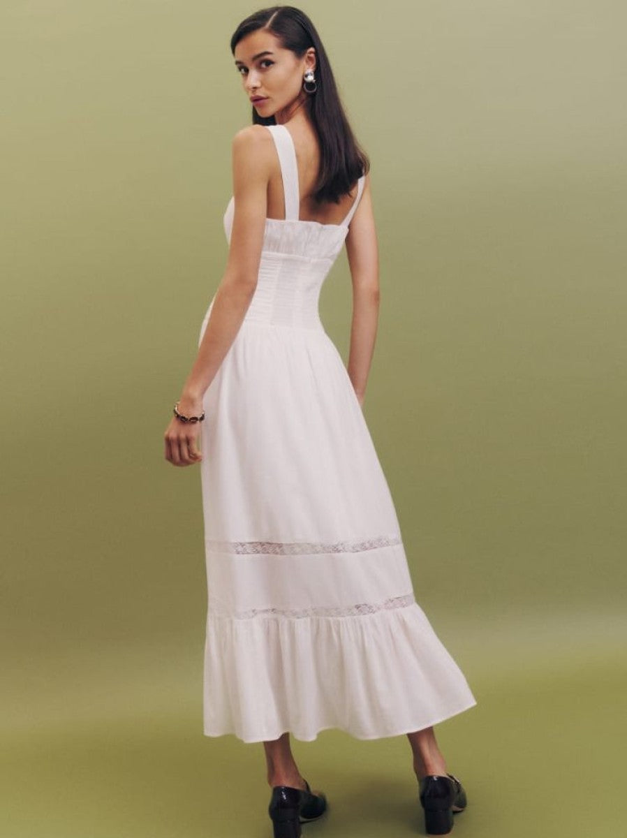 Indulge in effortless elegance with the Lisette Dress! This dreamy dress features a fitted bodice and relaxed skirt for a flattering silhouette. The back smocking, adjustable straps, and scoop neckline provide a comfortable and customizable fit. Perfect for any occasion, this dress will make you feel confident and beautiful!