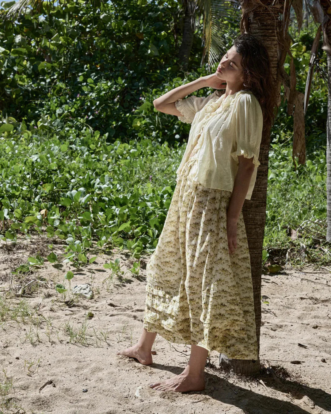 Elevate your wardrobe with the Marcie Skirt in Citron Rosier Floral by Doen, designed for timeless elegance and comfort. Crafted from a soft organic cotton and viscose blend, this high-waisted skirt features a flowing ankle-length silhouette adorned with a vintage-inspired poppy field print. Pintuck details and an invisible side zipper provide a flattering fit, making it a versatile choice for both casual days and special occasions. Experience effortless style with every wear.