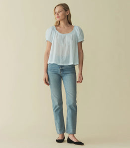 Rendered in 100% organic cotton voile, the Frederica Top features a breezy silhouette, a round neckline, and short puffed sleeves adorned with scalloped lace. Alternating pintuck clusters, lace, and delicate floral embroidery decorate the front. Leave it loose, or tuck it into your favorite pair of high-waisted jeans.