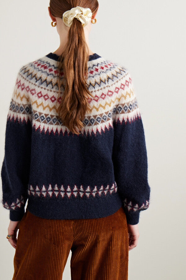 Introducing the Amble Cardigan by DÔEN. Made with a classic Fair Isle knit design, this cardigan provides both style and warmth. Perfect for any occasion, the Amble Cardigan is a versatile addition to any wardrobe.