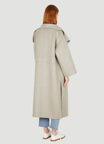 Load image into Gallery viewer, This luxurious signature cashmere coat in grey by TOTEME is the epitome of elegance and refinement. Made from premium cashmere, it provides ultimate warmth and comfort, making it the perfect addition to any sophisticated wardrobe. Elevate your style with this timeless piece.
