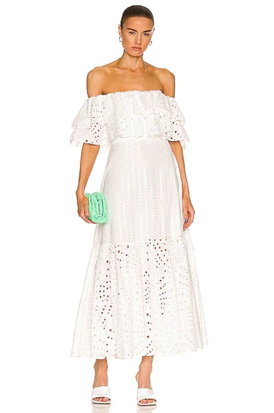 Get ready to show off your fun and flirty side with the Isabella Maxi Dress from Charo Ruiz! Made from a delicate broderie anglaise cotton-blend, this off-the-shoulder dress features tiered layers for added movement and style. Perfect for any occasion, this midi dress will have you feeling confident and fabulous.