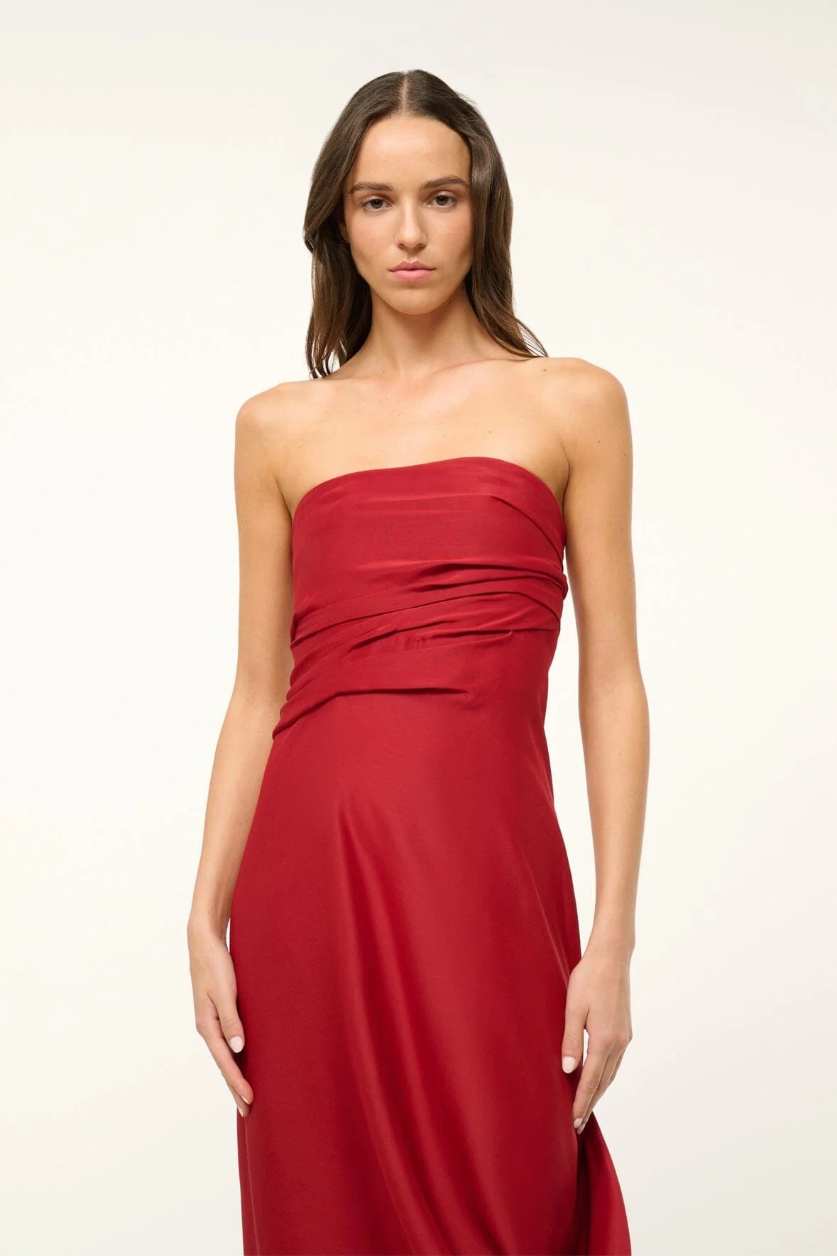 Unleash your daring side with the Caravaggio Dress Rouge by STAUD! This luxurious maxi dress, crafted from a silk wool blend, drapes elegantly and offers structural support with its built-in corset. Perfect for any adventure, this dress combines ease and sophistication. Embrace the challenge and stand out in style!