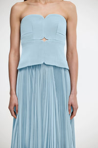 Introducing the Avonlea Dress by ACLER - a modern interpretation of the timeless Acler silhouette. Crafted in Celeste Blue, this midi dress boasts a structured bodice and square neckline, perfectly complementing the signature pleated fabric for a feminine, flowing look. Elevate your style with this exclusive piece.