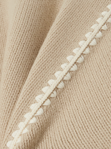 Elevate your wardrobe with this oversized sweater by Toteme crafted from a sumptuous wool and cashmere blend. Its relaxed fit with dropped shoulders offers effortless comfort, while the contrasting cream embroidery adds a refined, distinctive touch. Designed as a timeless staple, it seamlessly enriches your collection, providing both warmth and style for any occasion.