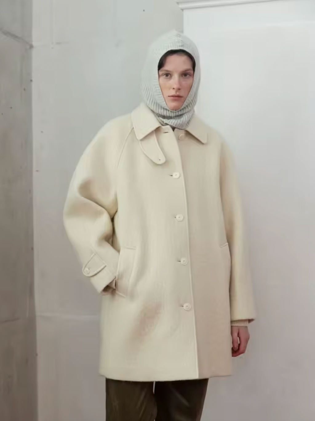 Experience effortless style and warmth with the Alpaca Half Coat, featuring a relaxed silhouette and distinctive round raglan sleeves. Available in two inviting colors—a textured grey for a sophisticated look and a cozy cream that exudes softness. Crafted from a high-quality blend rich in alpaca and wool, this coat ensures exceptional insulation, keeping you comfortably warm during colder days while elevating your everyday wardrobe.