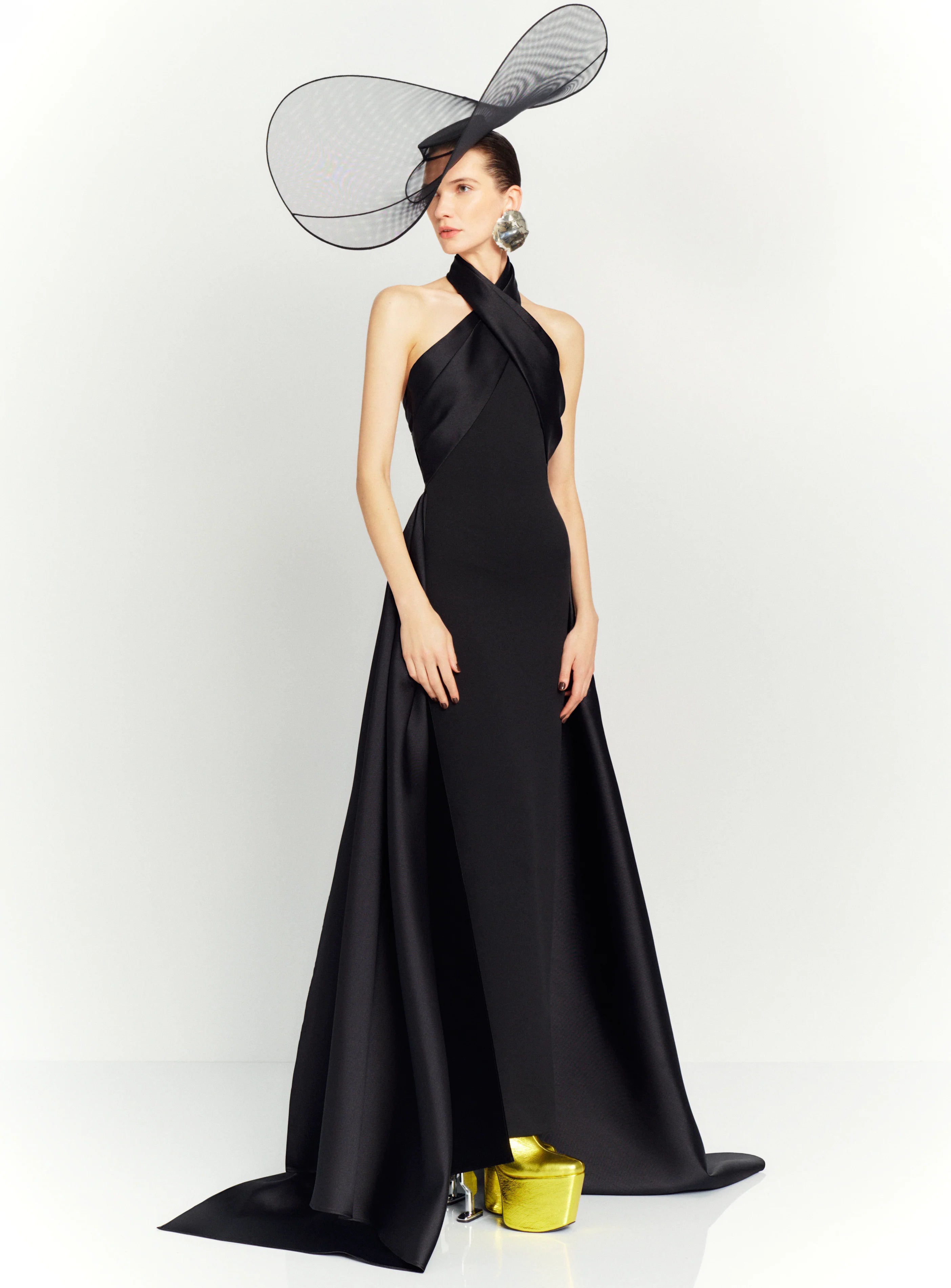 The dramatic silhouette of Solace London's 'Rumi' gown will ensure you'll make a memorable entrance. It's cut from stretch-crepe to hug your figure with glossy satin-twill that wraps around the neck and waist before falling at the sides to an asymmetric hem. Style yours with glittering earrings and elbow-length velvet gloves.