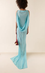 Experience the ethereal elegance of the Ameno dress by Jacquemus, crafted from light-as-air silk chiffon that drapes effortlessly along your back. Its flowing train mirrors the gentle movement of water, creating a captivating silhouette that turns every step into a statement of grace. Elevate your wardrobe with this stunning design that promises both beauty and fluidity.